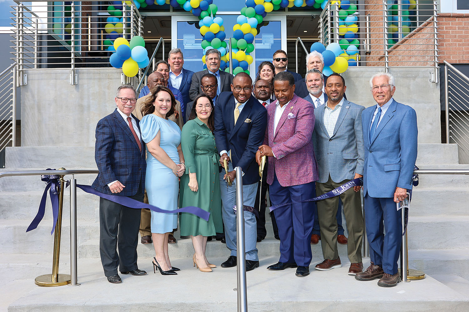 PortSL CEO Paul Matthews (center) cuts ribbon to ceremonially open new headquarters building. (Photo courtesy of Forest Photography LLC)