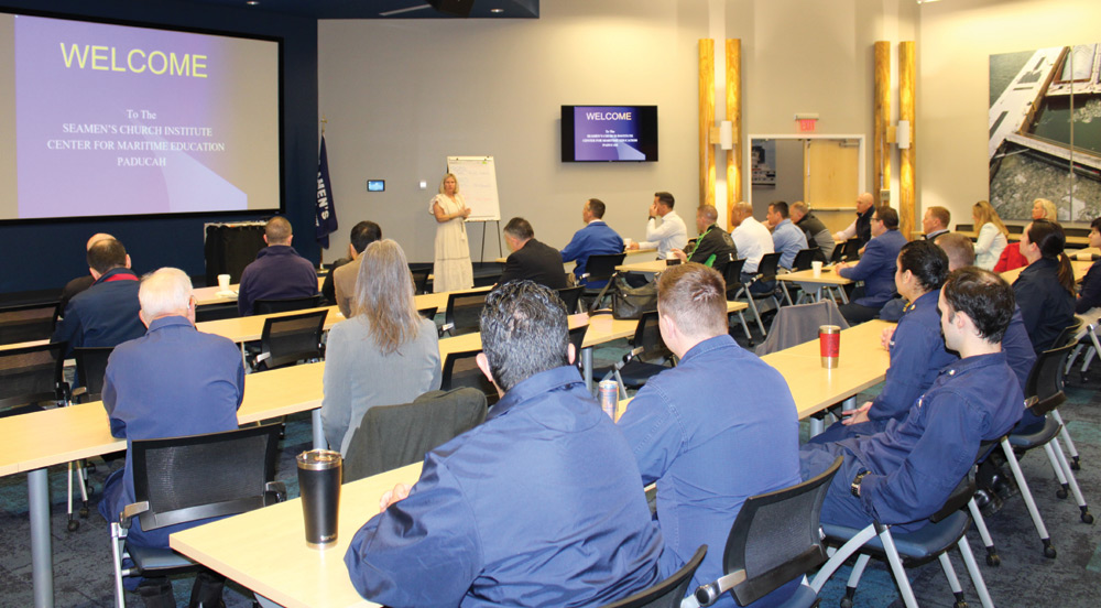 Sixteen students from the National Defense University’s Eisenhower School for National Security and Resource Strategy learn about Seamen’s Church Institute’s mission from SCI-Paducah’s Kelly Butts. (Photo by Shelley Byrne)