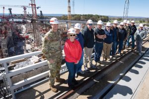 Lt. Col. Joseph Sahl (far left), U.S. Army Corps of Engineers Nashville District commander, poses March 20 with Corps officials and stakeholders overlooking the Chickamauga Lock Replacement Project on the Tennessee River in Chattanooga, Tenn. (USACE photo by Lee Roberts)