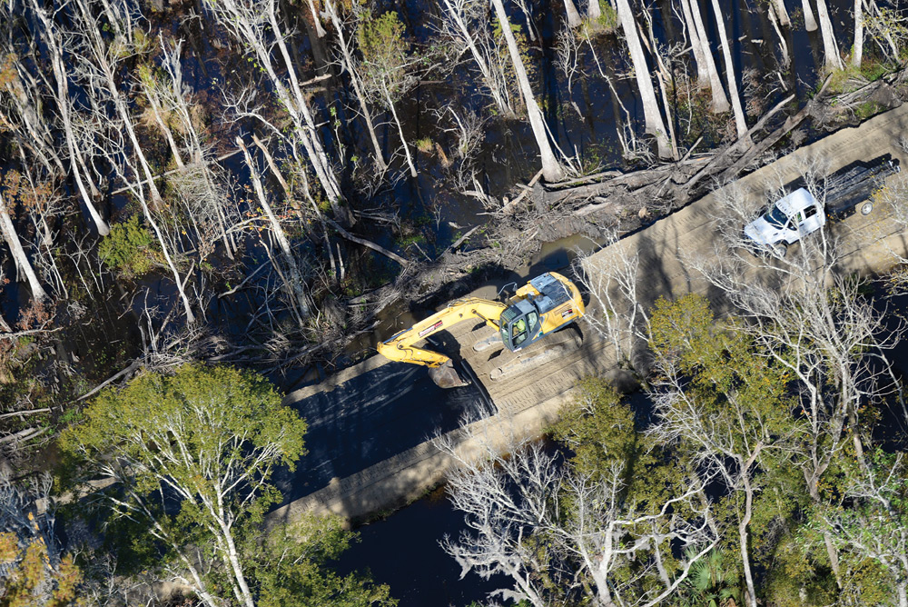 A bulldozer lays the foundation for an earthen levee that will make up part of the West Shore Lake Pontchartrain Hurricane and Storm Damage Risk Reduction project. The 18.5-mile system will protect communities from Lake Pontchartrain storm surge during hurricanes.