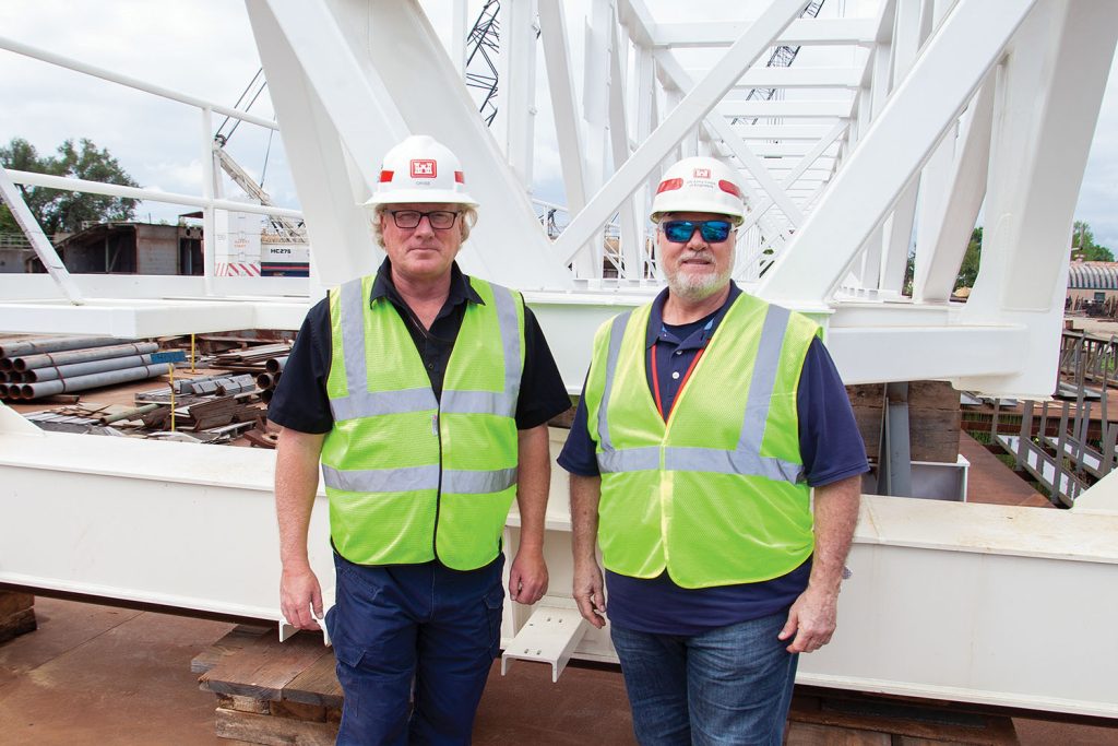 ARMOR 1 Project Manager John Cross (left) and Alvin Clouatre, construction representative for the project, stand in front of the superstructure for the ARMOR 1 tying gantry.(Photo by Frank McCormack)