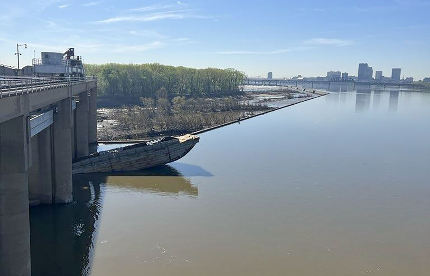 As of April 13, one corn barge remained lodged in McAlpine Dam. (Photo by Josh Saylor, U.S. Army Corps of Engineers)