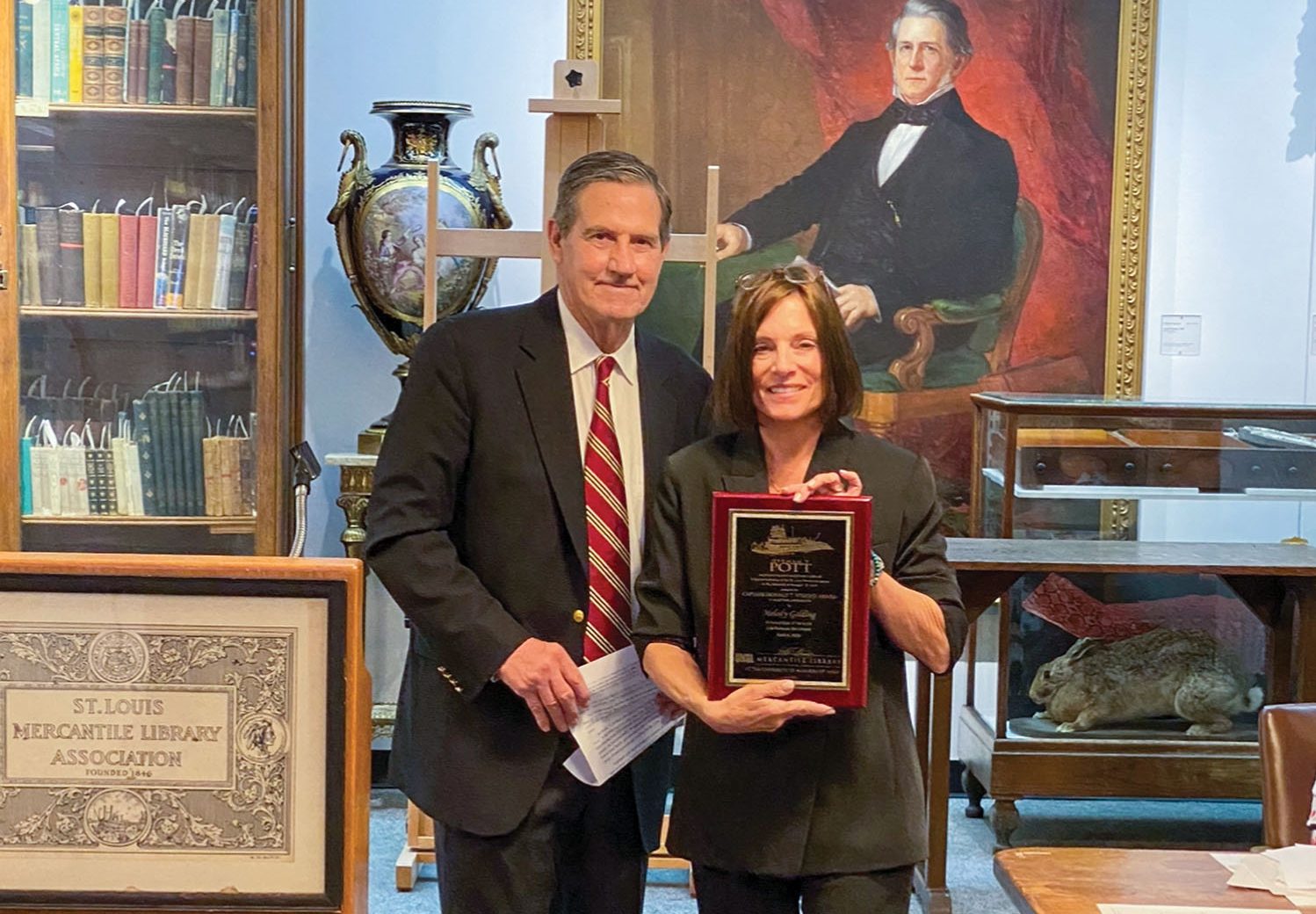 H. Nelson Spencer, chairman of The Waterways Journal, presents Donald T. Wright Award to Melody Golding. (Photos courtesy of St. Louis Mercantile Library)