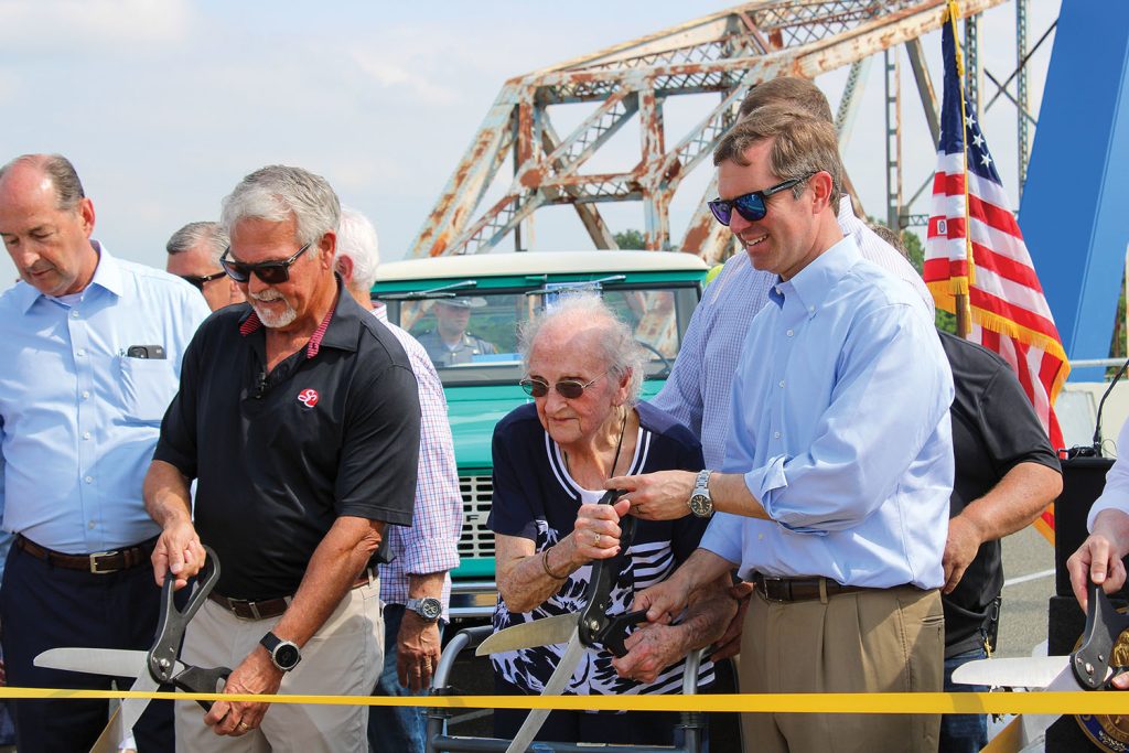 Rex Smith, president of Jim Smith Contracting Company, Muriel Dickerson, 102, of Salem and Kentucky Gov. Andy Beshear were among those who cut a ribbon to ceremonially open the bridge to traffic. (Photo by Shelley Byrne)