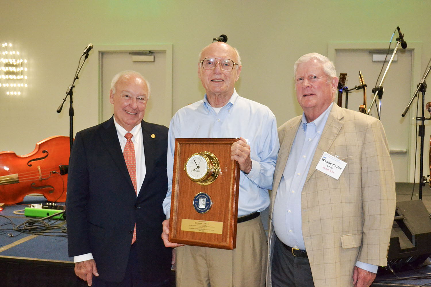 Charlie Haun, center, was honored for his 28 years of service as chairman of the Warrior-Tombigbee Waterway Association during the association's annual meeting. With him are Horace Horn, current chairman, and Wynne Fuller, president of the association. (Photo courtesy of WTWA)