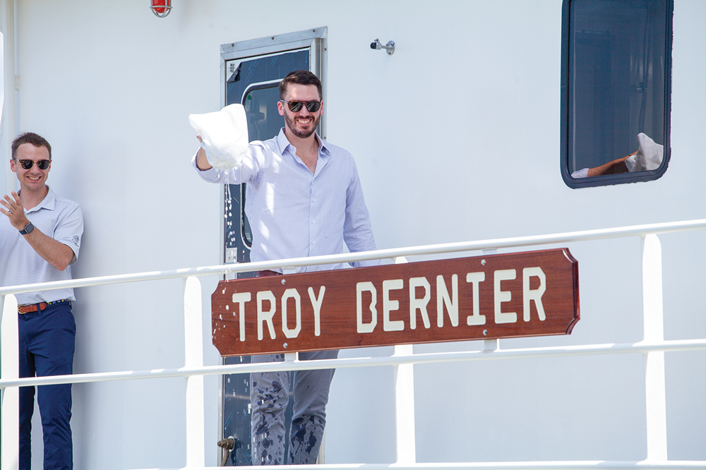 Troy Bernier, an associate at Maritime Partners, christens the towboat named in his honor. (Photos by Frank McCormack)