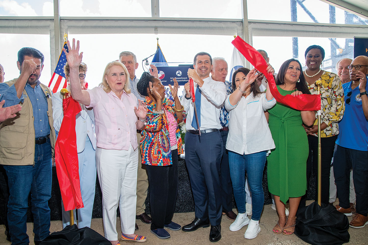 Transportation Secretary Pete Buttigieg, center, cuts the ribbon celebrating the completion of the Bayport Container Terminal Wharf 6 expansion project. (Photo courtesy of the Port of Houston)