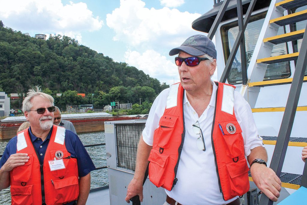 Chairman and CEO Peter Stephaich (right) making remarks to reporters as Richard Kreider, vice president of logistics, looks on from on board the Campbell Transportation Company boat the Darrell L. (photo by Shelley Byrne)