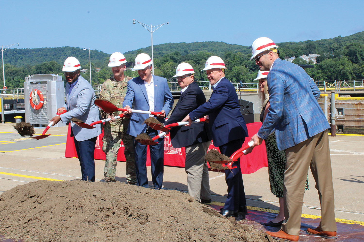 Corps, government and industry leaders turn shovels of dirt to ceremonially kick off the project. (photo by Shelley Byrne)