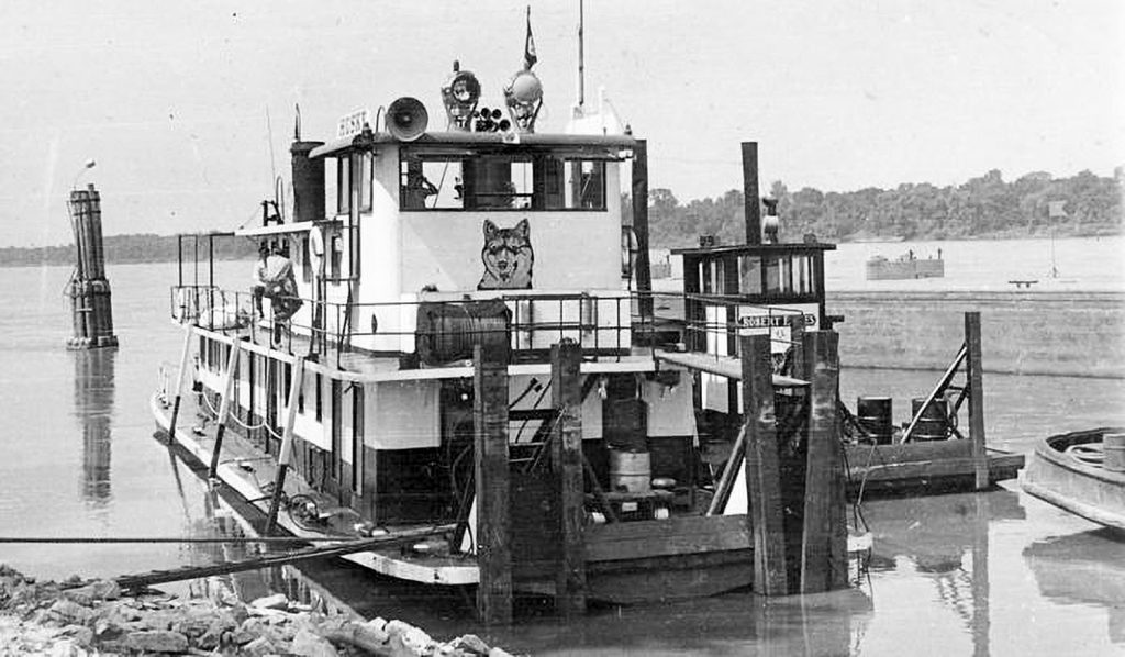 The Husky at Wood River, Ill., with the Robert E. Lies alongside.  (Dan Owen Boat Photo Museum collection)