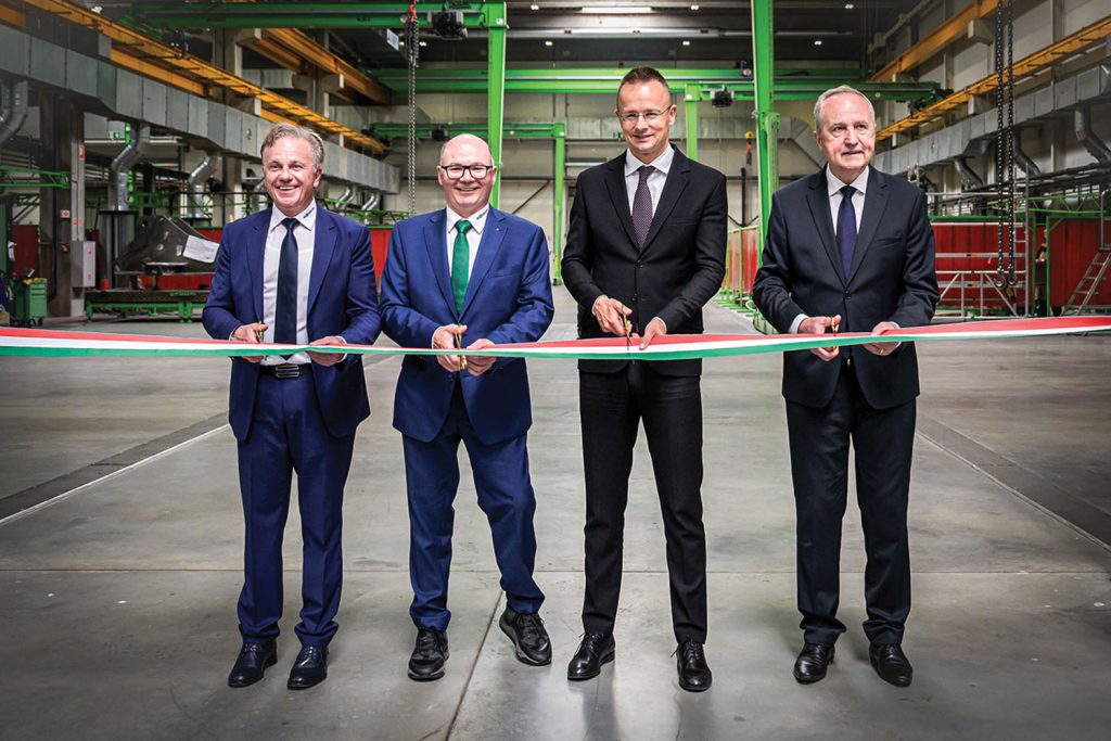 From left, managing director of the site Michael Seiferling, shareholder Walter Sennebogen, Foreign Minister Péter Szijjártó and Member of Parliament Károly Kontrát cut ribbon for new plant.