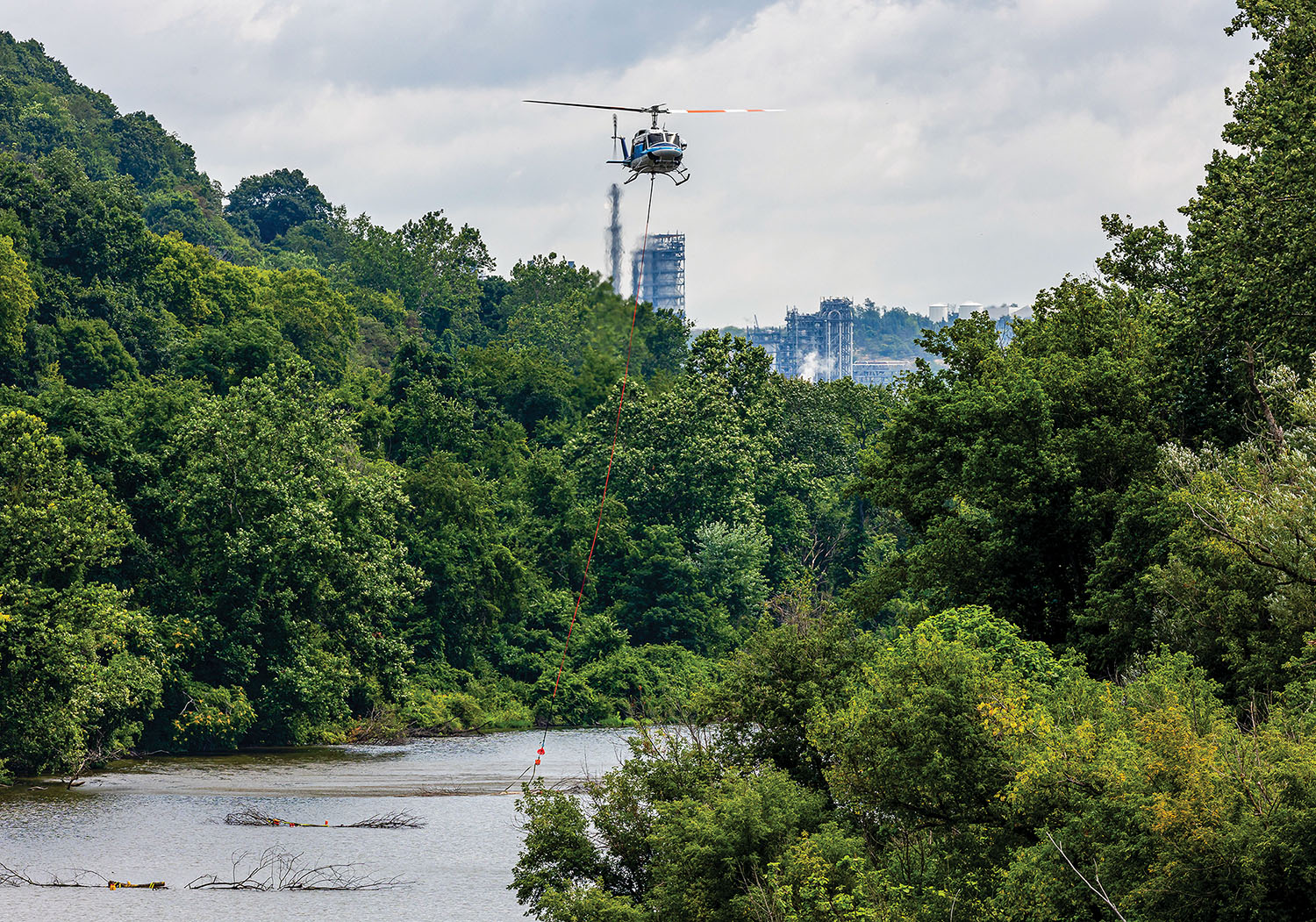 The Pittsburgh Engineer District placed bundles of trees—cut down to make way for a concrete batch plant at Montgomery Locks and Dam—into a slough in the Upper Ohio River in August as part of a unique program designed to prevent fish habitat loss from construction of new lock chambers. (Photo by Michel Sauret/Pittsburgh Engineer District)