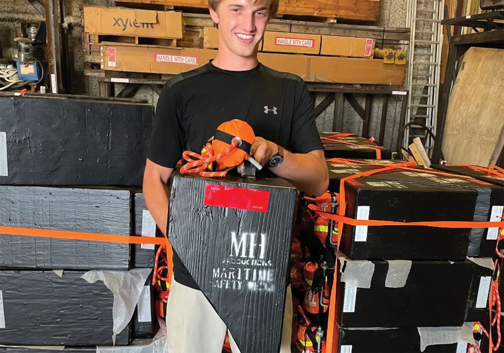 Miles Harris with the Maritime Safety Wedge, which he developed to protect mariners in man-overboard emergencies. (Photo from MH Production website)