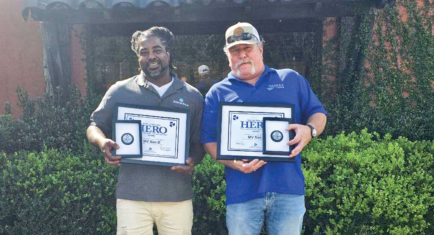 Deckhand Darius Thomas and Pilot Nick Verdugo received the AWO HERO Award for rescuing boaters near Mobile, Ala., earlier this year. (Photo courtesy of Parker Towing)