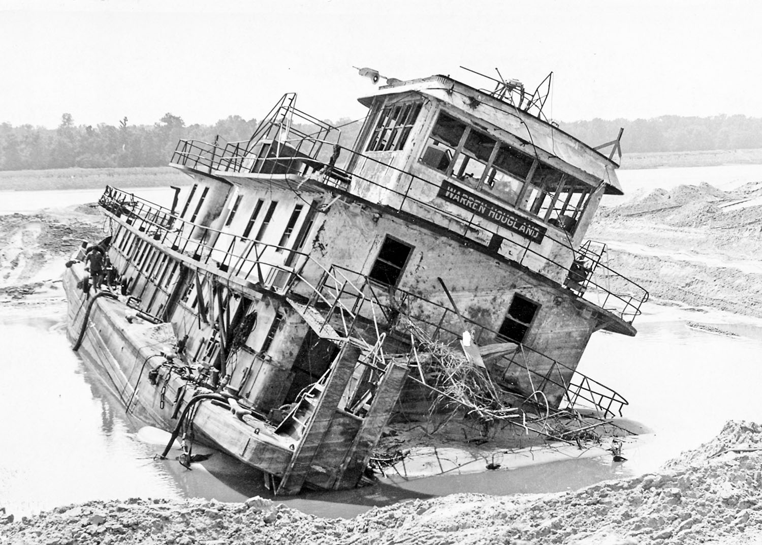 The Warren Hougland at Mile 412.3 Lower Mississippi River, August 23, 1973, emerging from the sand during salvage. (Dan Owen Boat Photo Museum collection)