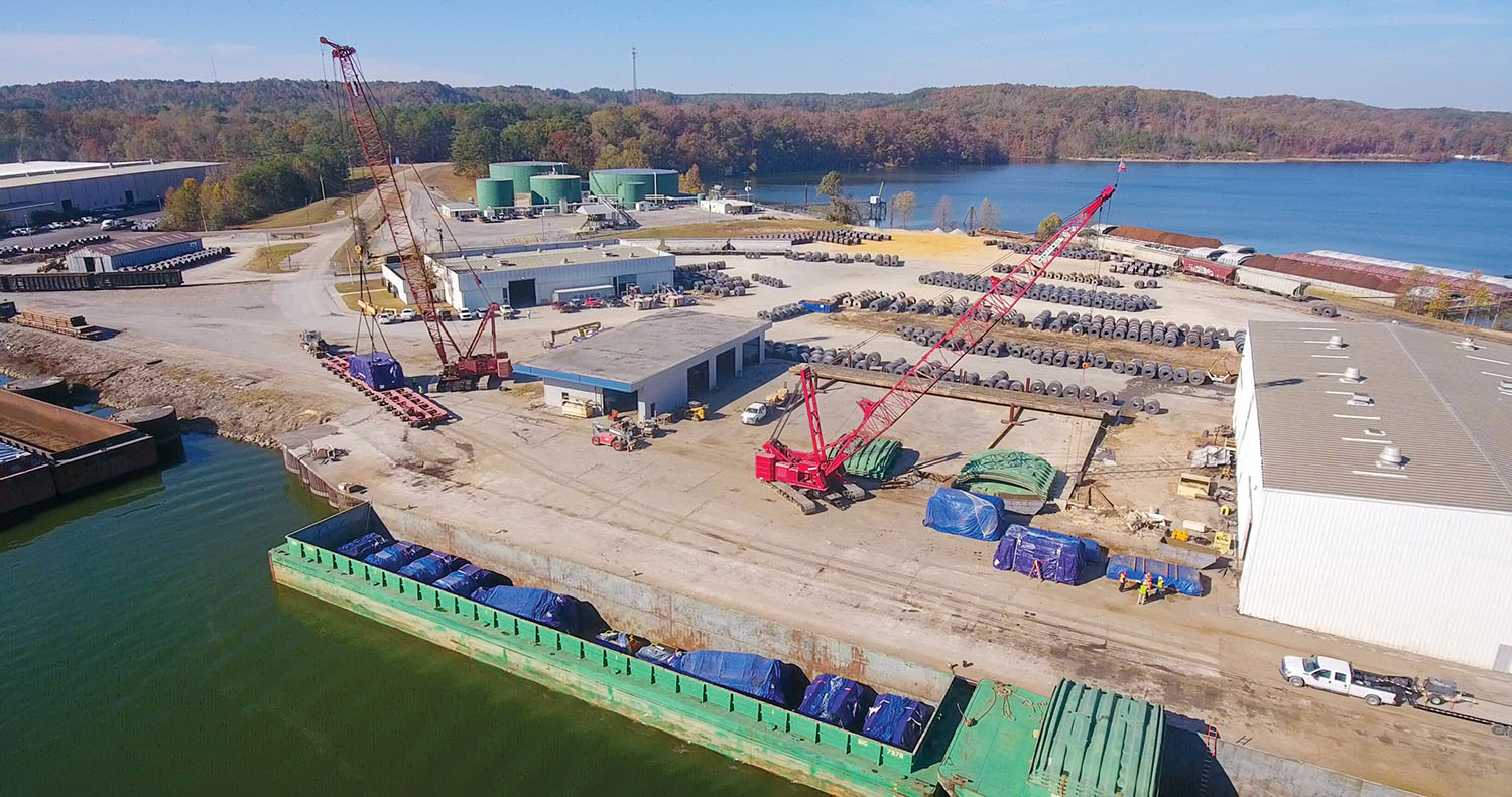 The first five barges of Chinese-made equipment for the new Ford Motor Company battery plant being built in Haywood County, Tenn., were rerouted via the Tennessee-Tombigbee Waterway because of low water on the Lower Mississippi. The equipment was unloaded at Yellow Creek Port, with two terminals in Burnsville and Iuka, Miss. (Photo courtesy of Yellow Creek Port)