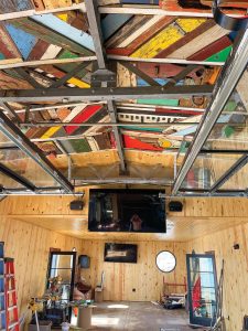 Multicolored scrap wood ceiling. (Photo courtesy of Living Lands & Waters)