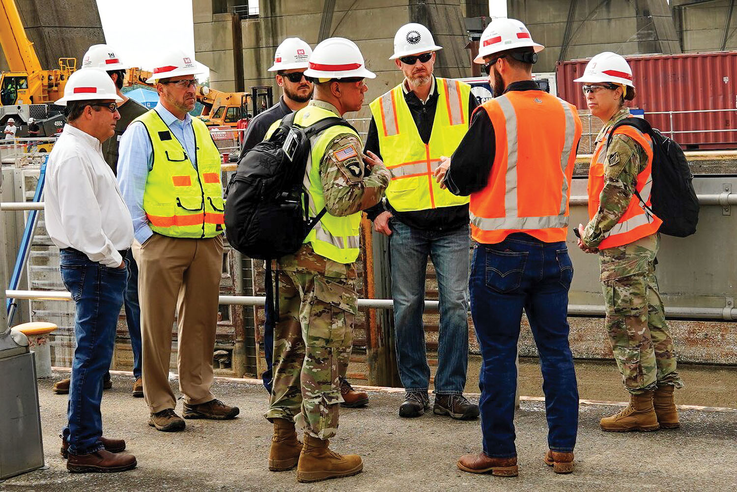 Great Lakes and Ohio River Division Commander Brig. Gen. Mark C. Quander visits John T. Meyers Locks and Dam in Mt. Vernon, Ind., September 12 to receive an update From Waylon Humphry, Louisville District Operations Division chief and Stephen Porter, Regional Rivers Repair Fleet chief, on the miter gate replacement project. (Photo by Abby Korfhage/Louisville Engineer District)