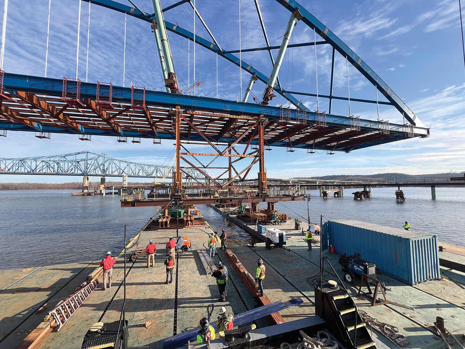 The new eastbound span of the McClugage Bridge over the Illinois River in Peoria, Ill., was floated 300 yards from the assembly site on jumbo barges before being lifted into place. The bridge carries U.S. 150 at Illinois River Mile 165.8. (Photo by Capt. Tony Ice)