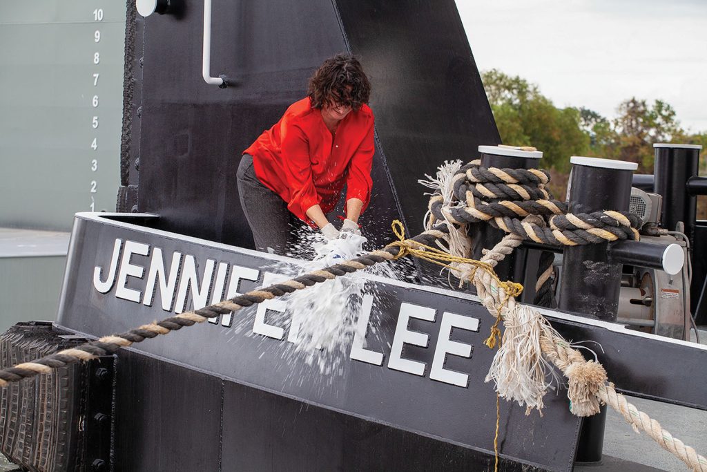 Jennifer Brown breaks bottle to christen the mv. Jennifer Lee. (Photo by Frank McCormack)