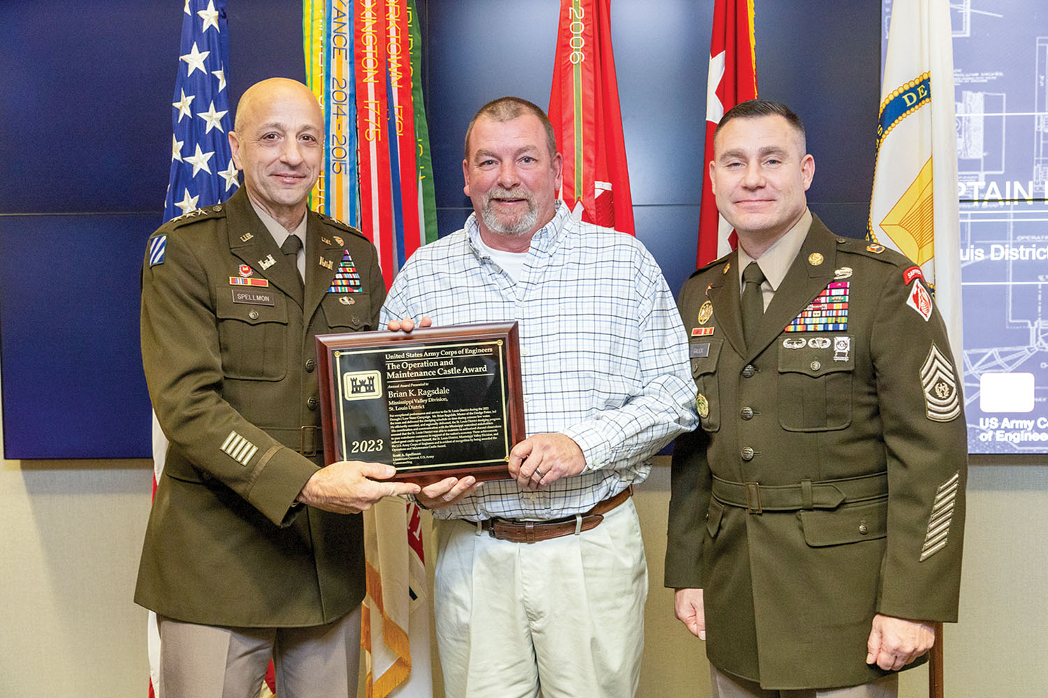 U.S. Army Corps of Engineers Chief of Engineers and Commanding General Lt. Gen Scott Spellmon presents Brian Ragsdale, St. Louis District Dredge Potter master, with the 2023 Chief of Engineers Operations and Maintenance Castle Award during the 2023 National Awards Ceremony at the Corps of Engineers headquarters in Washington, D.C., November 29. (Photo courtesy of St. Louis Engineer District)