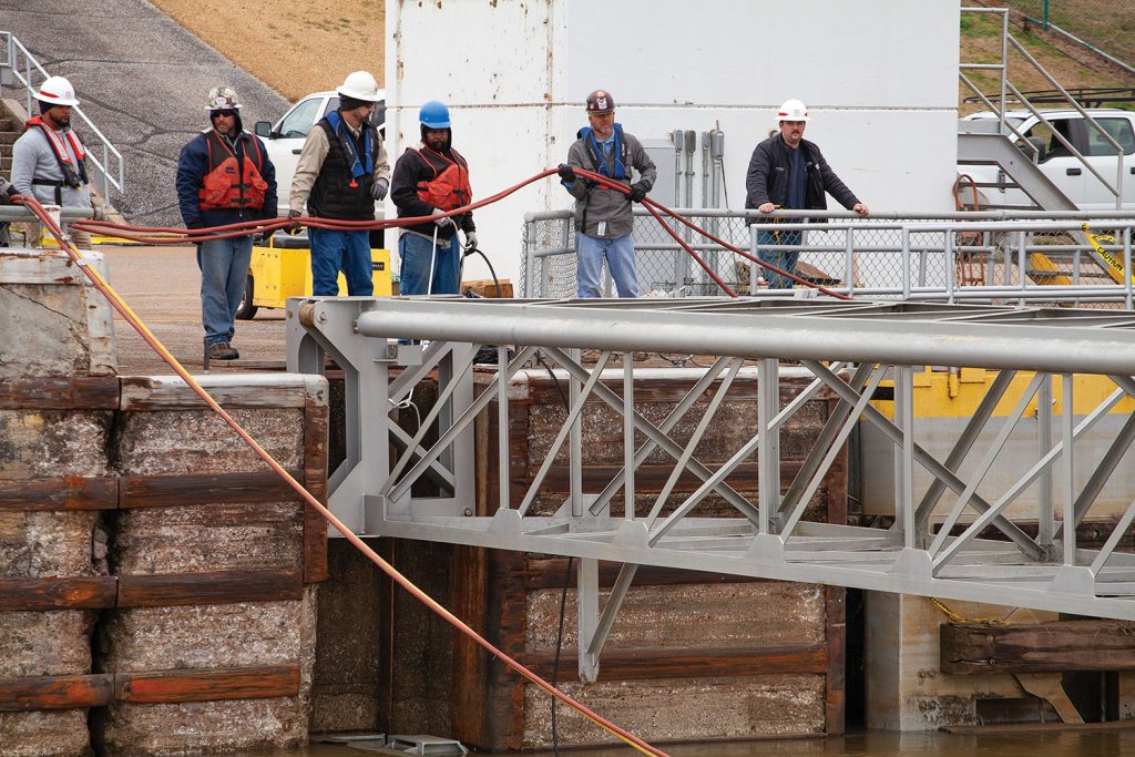 Corps of Engineers crews had to remove and reset stoplogs at Demopolis Lock last week to position vessels for the repair project, which is expected to last until May.   (Photo by Frank McCormack)