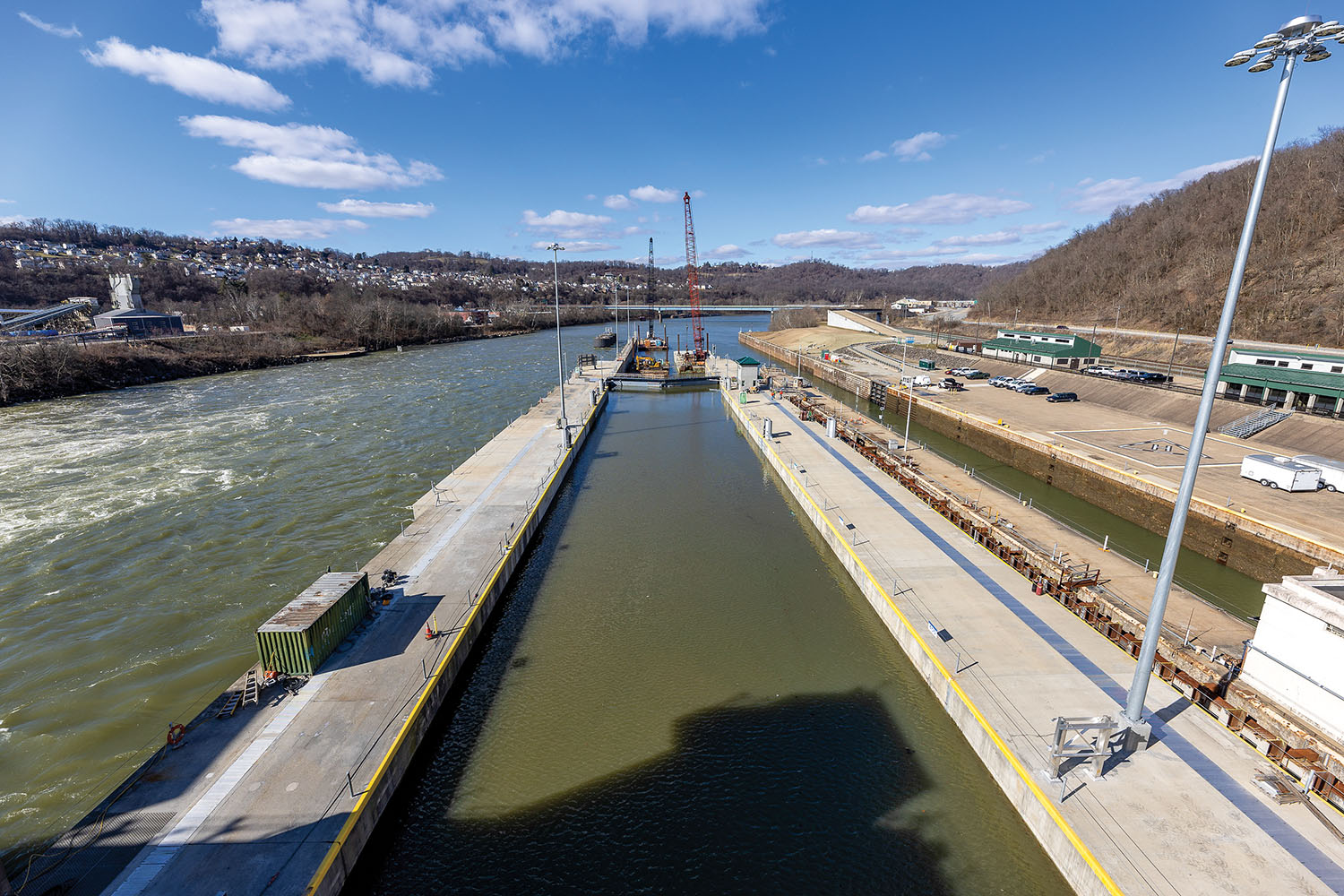 A downstream view of the newly constructed lock chamber at the Monongahela River Locks and Dam 4 in Charleroi, Pa., taken on February 14. The U.S. Army Corps of Engineers is currently conducting fully integrated system tests on the new navigation chamber, which measures 84 feet wide by 720 feet long. The Pittsburgh District continues to adjust the system’s programming to prepare the lock to open for navigation later this year. The facility is part of the Lower Monongahela River Project, which includes locks and dams at Charleroi, Elizabeth and Braddock, Pa. The three locks experience the highest volume of commercial traffic on the entire Monongahela River navigation system. (U.S. Army Corps of Engineers Pittsburgh District photo by Michel Sauret)