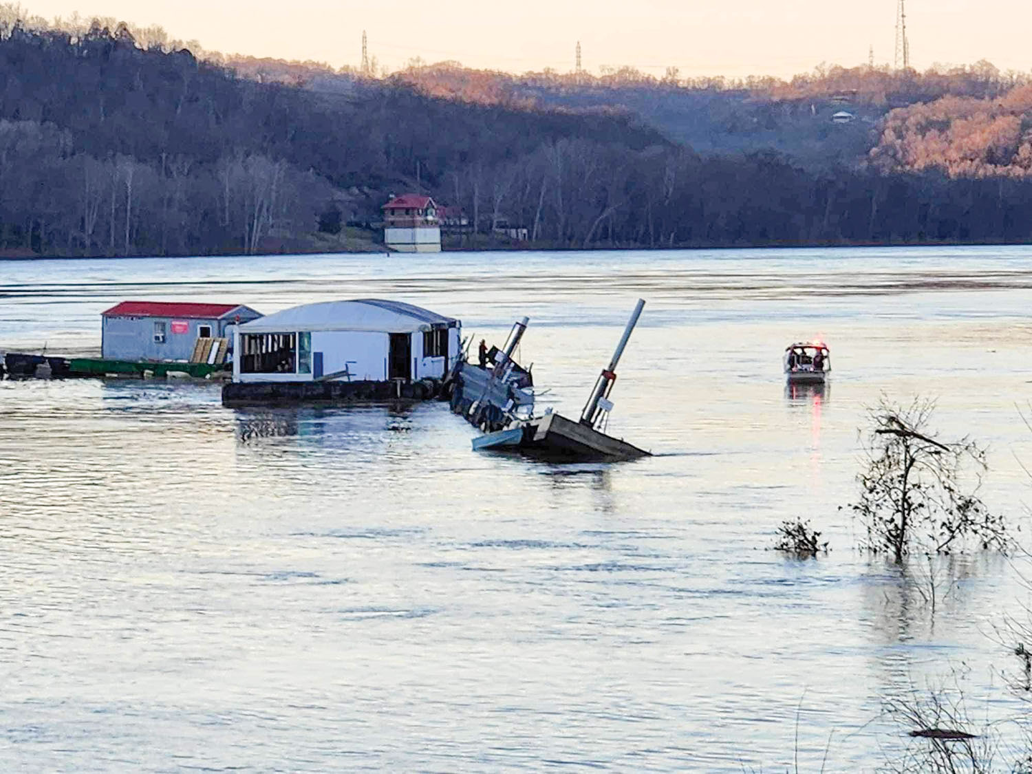 Skipper’s River Cafe and Steamboat Marina floats downstream on the Ohio River February 3. (Photo courtesy of New Richmond Fire & EMS)