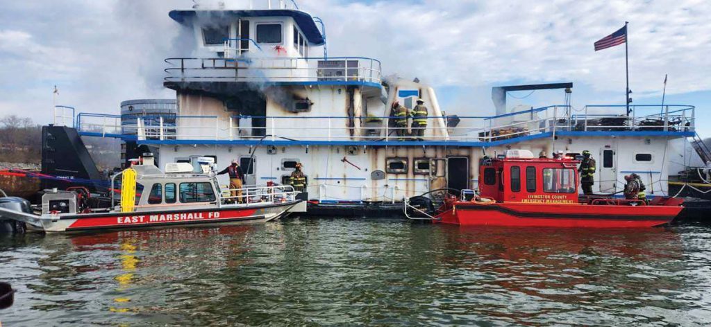 Firefighters battle an engineroom fire January 30 aboard the Johnny M on Kentucky Lake, just south of Kentucky Lock. No one was injured.(Photo courtesy of Marshall County Rescue Squad)