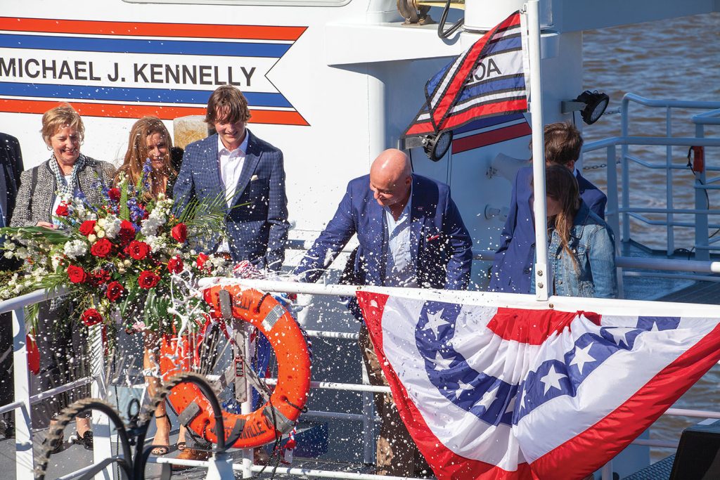 Mike Kennelley christens his namesake towboat. (Photo by Frank McCormack)