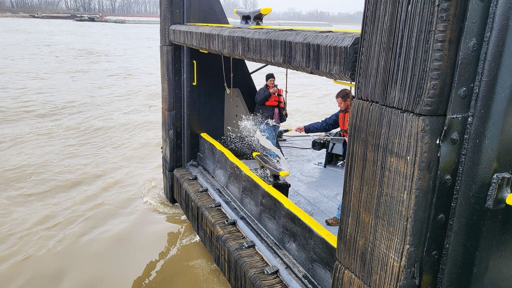 Todd Rushing christens the mv. Capt. Mike Rushing. (Photo by Zac Metcalf)