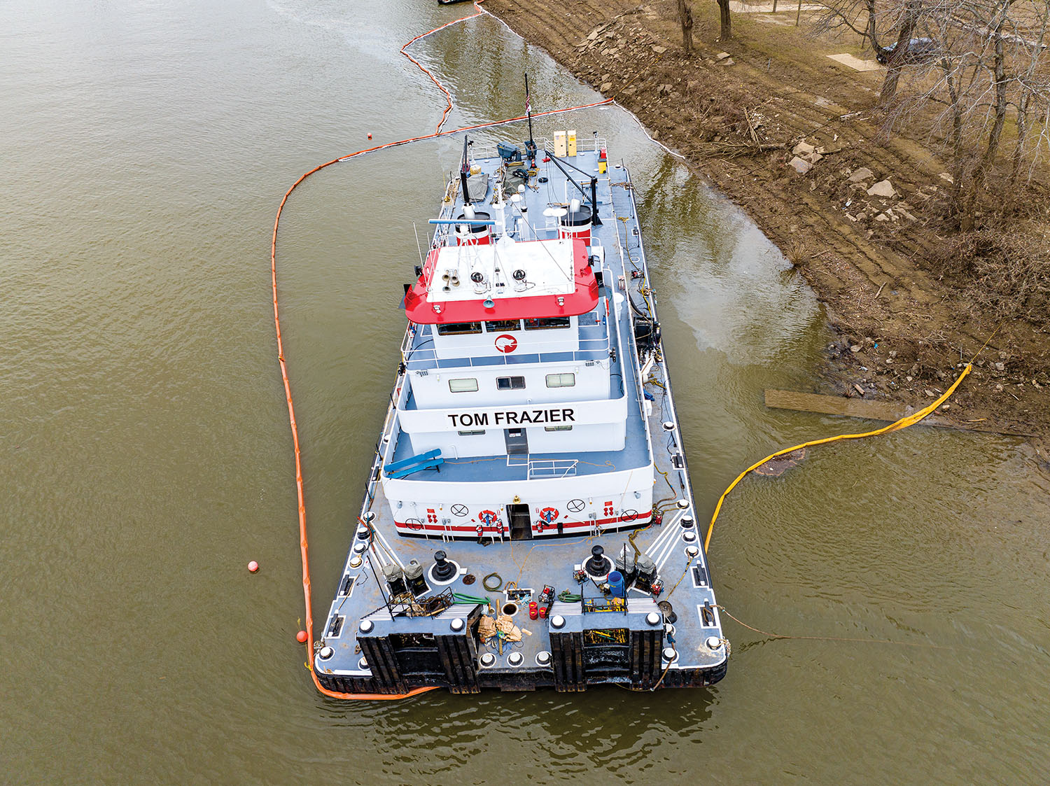 A protective boom was put in place around the mv. Tom Frazier following its partial sinking. No one was hurt, and no environmental damage was reported. (Photo by Steve Griggs)