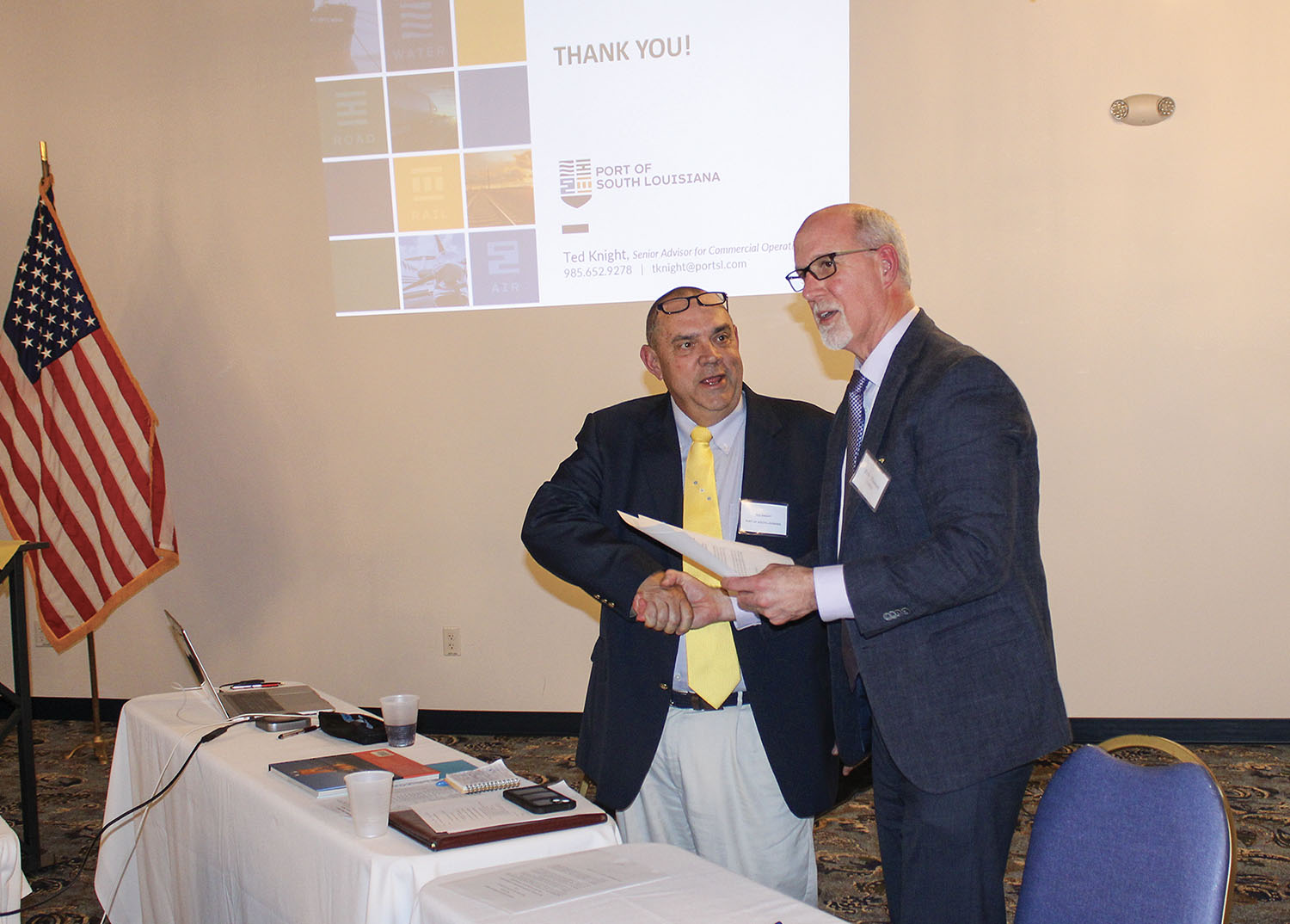 CORBA Executive Director Eric Thomas (right) and Ted Knight, senior adviser for commercial operations for the Port of South Louisiana, shake hands after signing a Memorandum of Understanding (MOU). (Photo by Shelley Byrne)