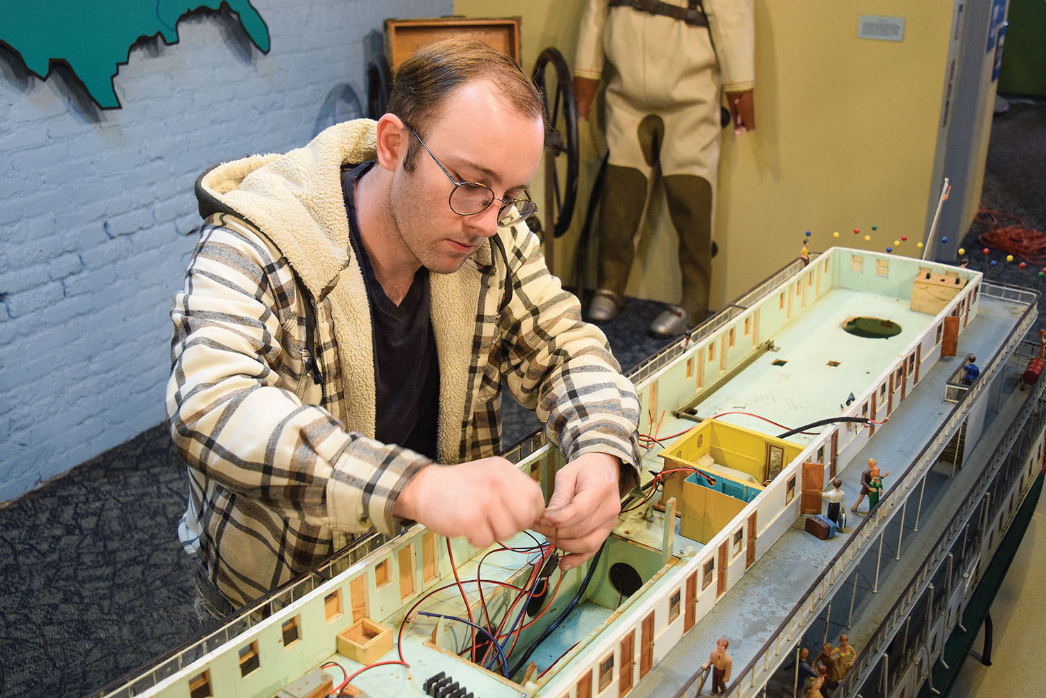 Richard Benson of Micro-IT works on the DQ model. (Photo courtesy of the Inland Waterways Museum)