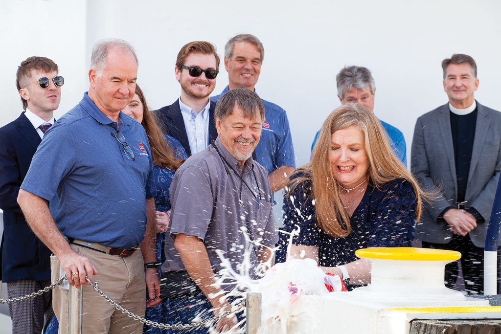 Tammy Morton, wife of Patrick Morton, Ingram vice president-logistics and customer services, christens the mv. Patrick L. Morton. (Photo by Frank McCormack)