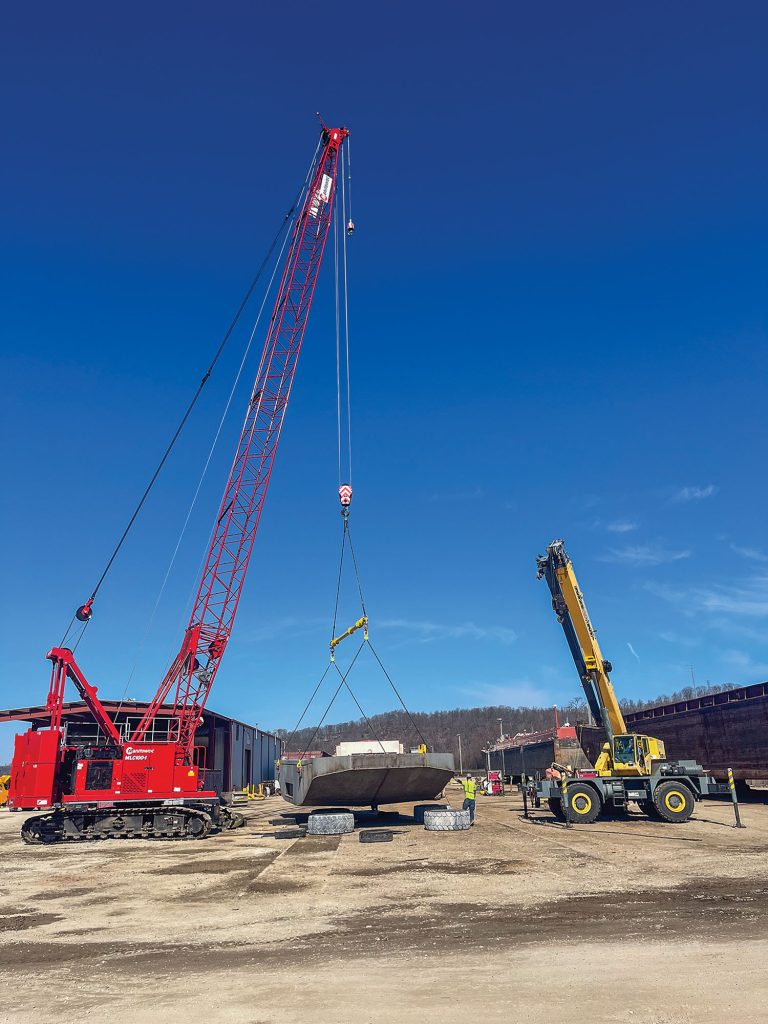 With the hull complete, it was flipped over to begin piping and the house being stacked on board. (Photo courtesy of McGinnis Inc.)