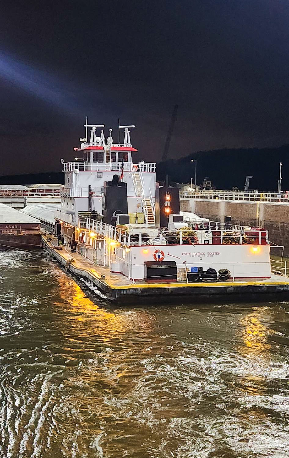 The mv. Joseph Patrick Eckstein of Marquette Transportation Company locks through Lock and Dam 2. (Photo courtesy of St. Paul Engineer District)