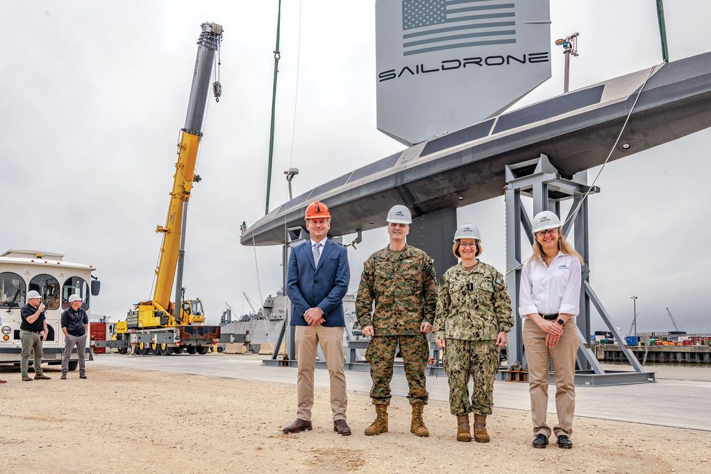 Saildrone founder and CEO Richard Jenkins, ACMC Gen. Christopher J. Mahoney, CNO Adm. Lisa Franchetti and Austal USA acting President Michelle Kruger stand in front of SD-3000, the first production Saildrone Surveyor USV to come off the Austal USA manufacturing line. (Photo courtesy of Austal USA)