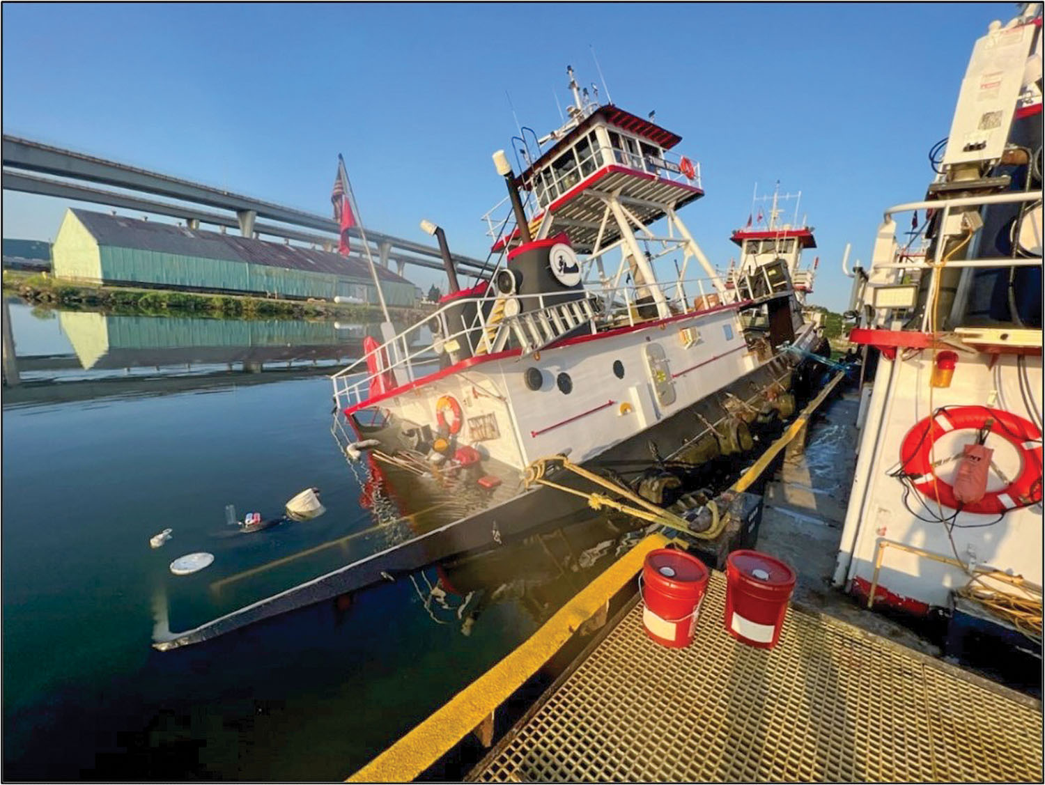 The mv. Joanne Marie partially sank at its mooring on the Harvey Canal on June 25, 2023. (U.S. Coast Guard photo)