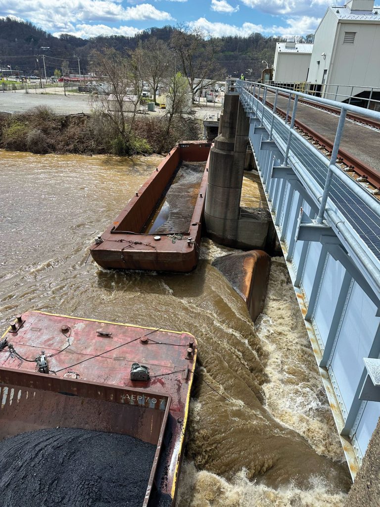 Barges rest against the dam at Emsworth Locks and Dam following a 26-barge breakaway on April 12. Five barges were removed April 16, leaving two at Emsworth. (Photo courtesy of Pittsburgh Engineer District)