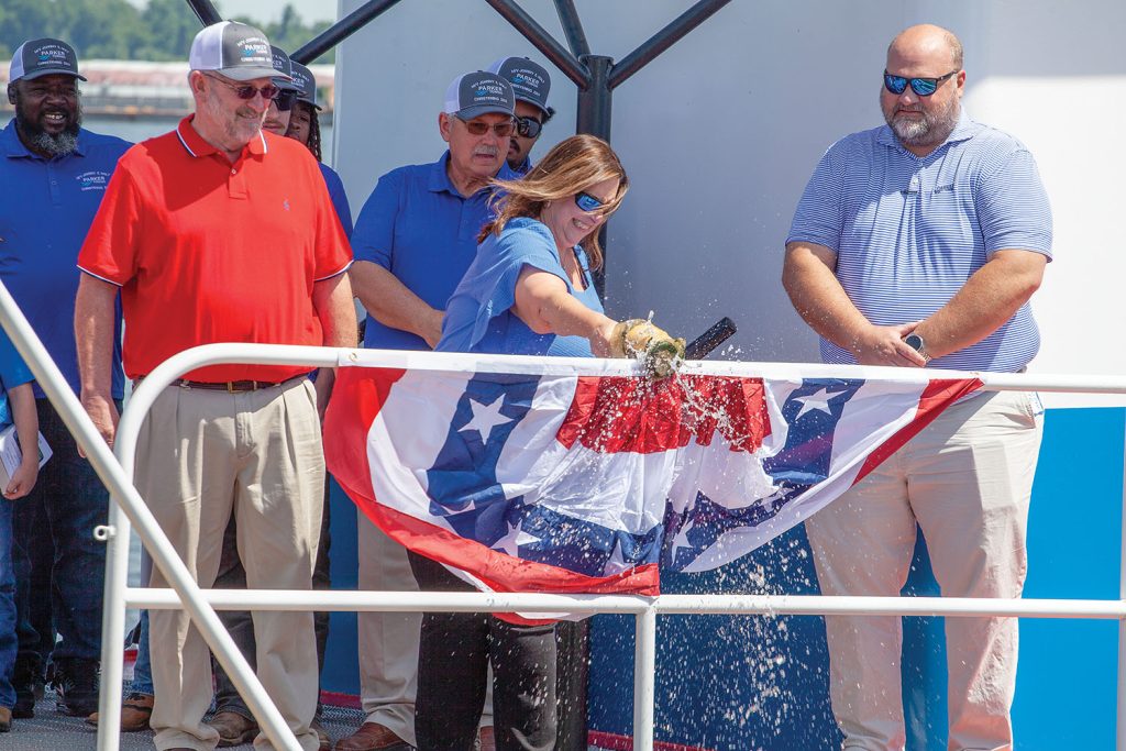 Connie Holt, wife of Johnny Holt (left), Parker Towing Company’s senior port engineer, christens the mv. Johnny E Holt at the Port of Decatur, Ala. (photo by Frank McCormack)