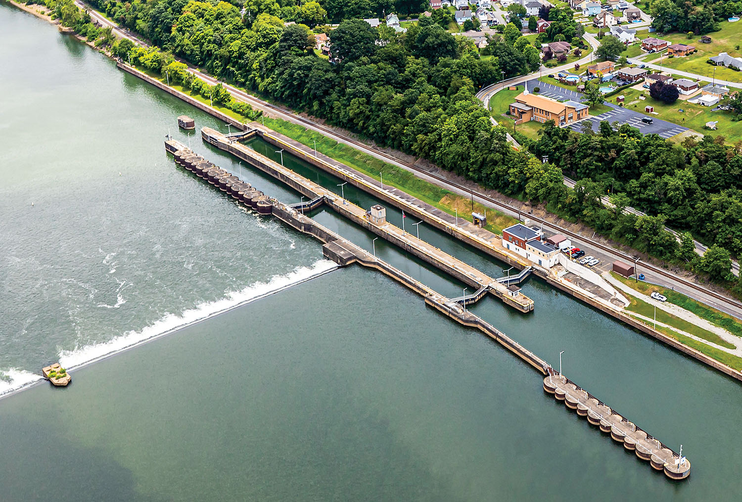 The dam at Monongahela Locks and Dam 3 at Elizabeth, Pa., will be removed by explosive demolition beginning the week of July 8 to create a navigable pass in a 30-mile pool between Locks and Dam 2 at Braddock and Locks and Dam 4 at Charleroi. Construction on the Elizabeth Facility, Mile 23.8, began in 1905 and was completed in 1907. (Photo by Michel Sauret/Pittsburgh Engineer District)