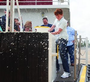 Travis Adams, David North’s grandson, christens his namesake vessel in a ceremony held April 3 at Ingram’s Triangle Fleet in Reserve, La. (Photos by Frank McCormack)
