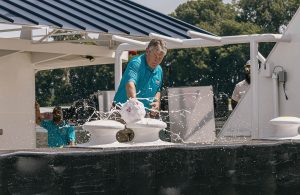John Roberts, CEO of Ingram Marine Group, christens his namesake vessel.