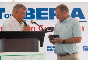 Lieven Bauwens, managing director and CEO of E-Crane Worldwide, presents a commemorative key to Lance Rase with CGB Enterprises during the christening ceremony for the crane barge Creole King.