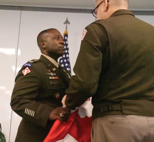 Col. Kelcey Shaw receives the district guidon from Brig. Gen. Zachary Miller during the change of command ceremony in Mobile, Ala. (Photo courtesy of the Mobile Engineer District).