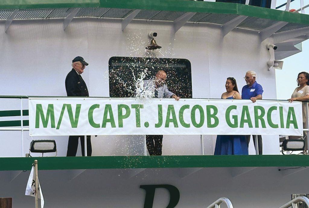 Blessey captain Jacob Garcia christens his namesake vessel. (Photo courtesy of Jacob Garcia)