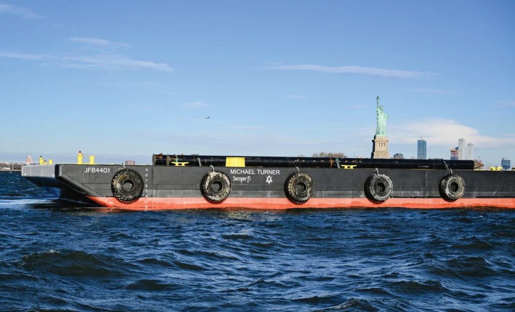 J.F. Brennan Company’s barge Michael Turner passes the Statue of Liberty in New York City. (Photos courtesy of J.F. Brennan Company)