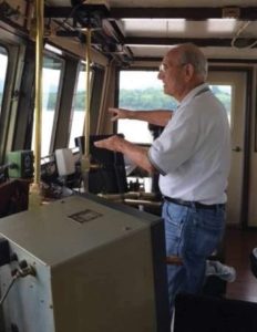 Capt. Lonnie Ryan explaining the effects of outdraft to a young pilot aboard the mv. Smitty in 2015.