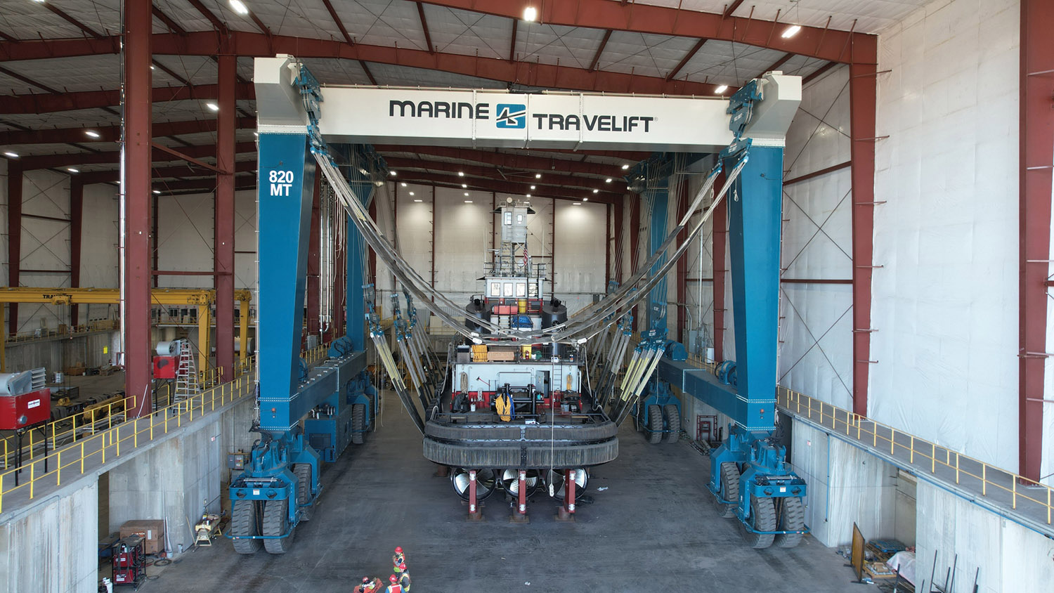 A vessel is lifted inside Carver Marine Steel Works’ enclosed facility by the company’s 820-metric-ton Marine Travelift, allowing crews to complete repair and retrofit work in a controlled indoor environment. (Photos courtesy of Carver Marine Steel Works)